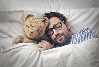 Man Sleeping With Teddy Bear