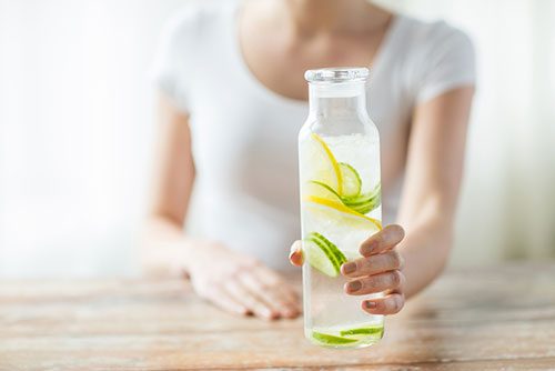 Woman WIth Lemon Water