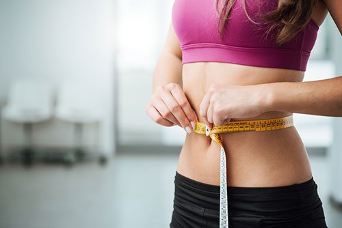 Woman measuring Stomach